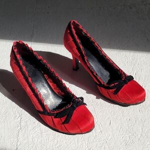 Elegant Red Heels with Black Trim